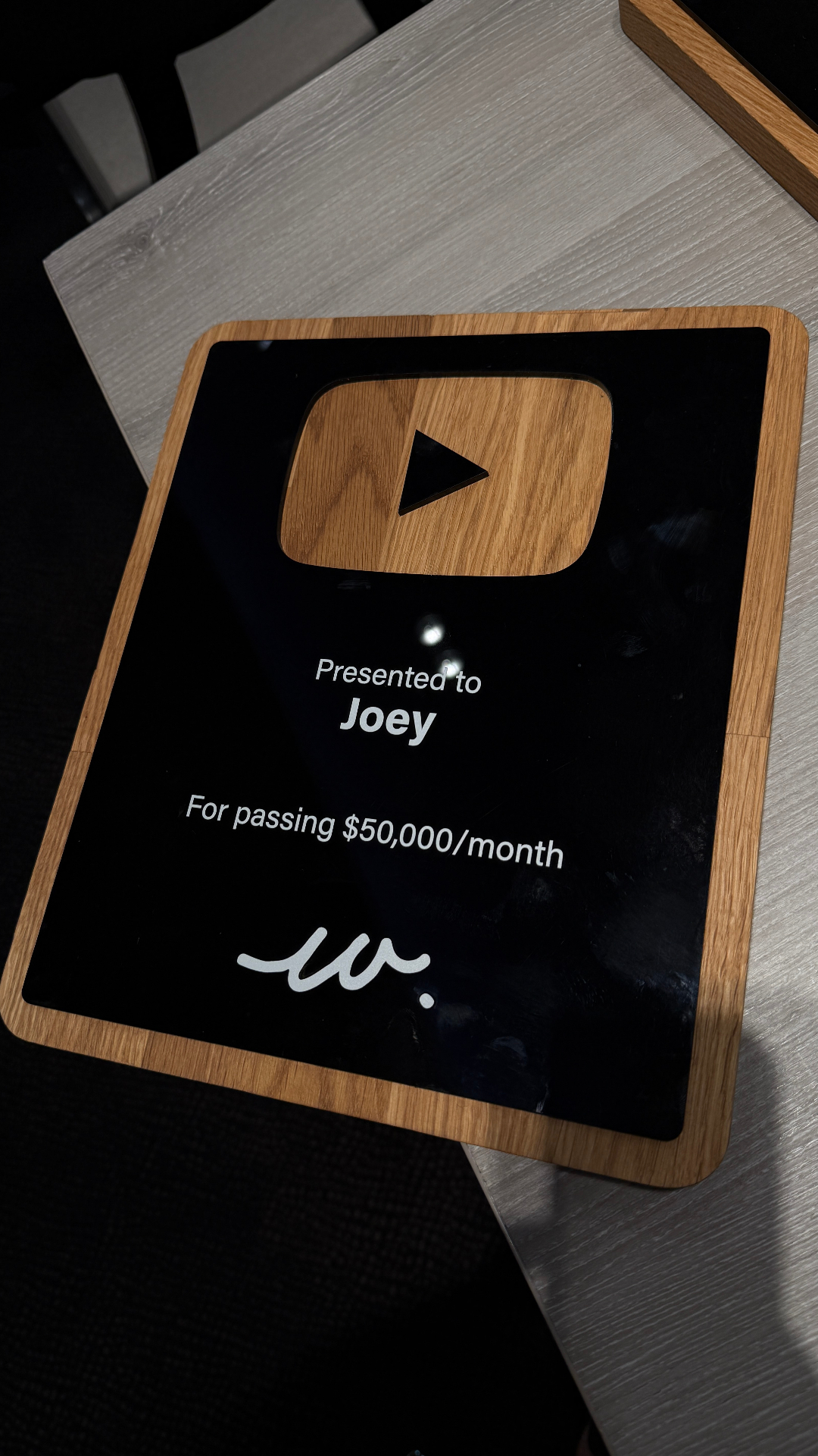 Joey receiving a 50K per month award at the live event