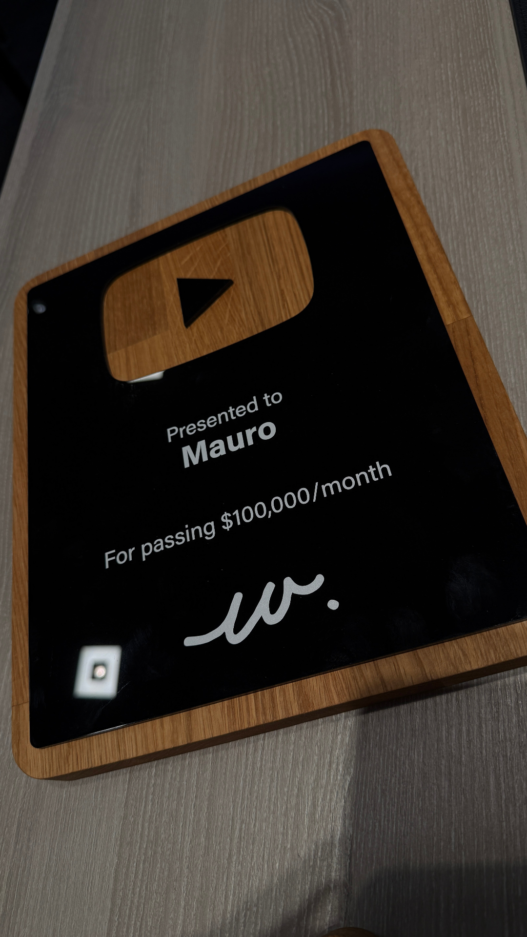 Mauro receiving a 100K per month award at the live event