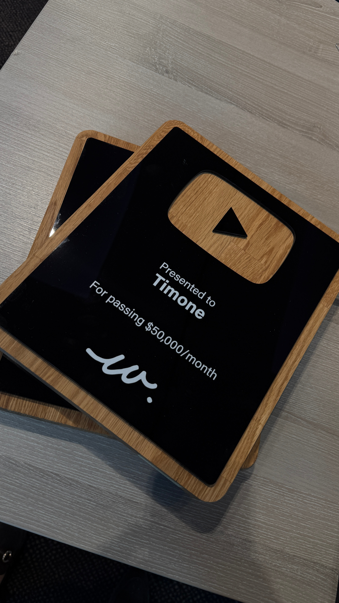 Timone receiving a 50K per month award at the live event